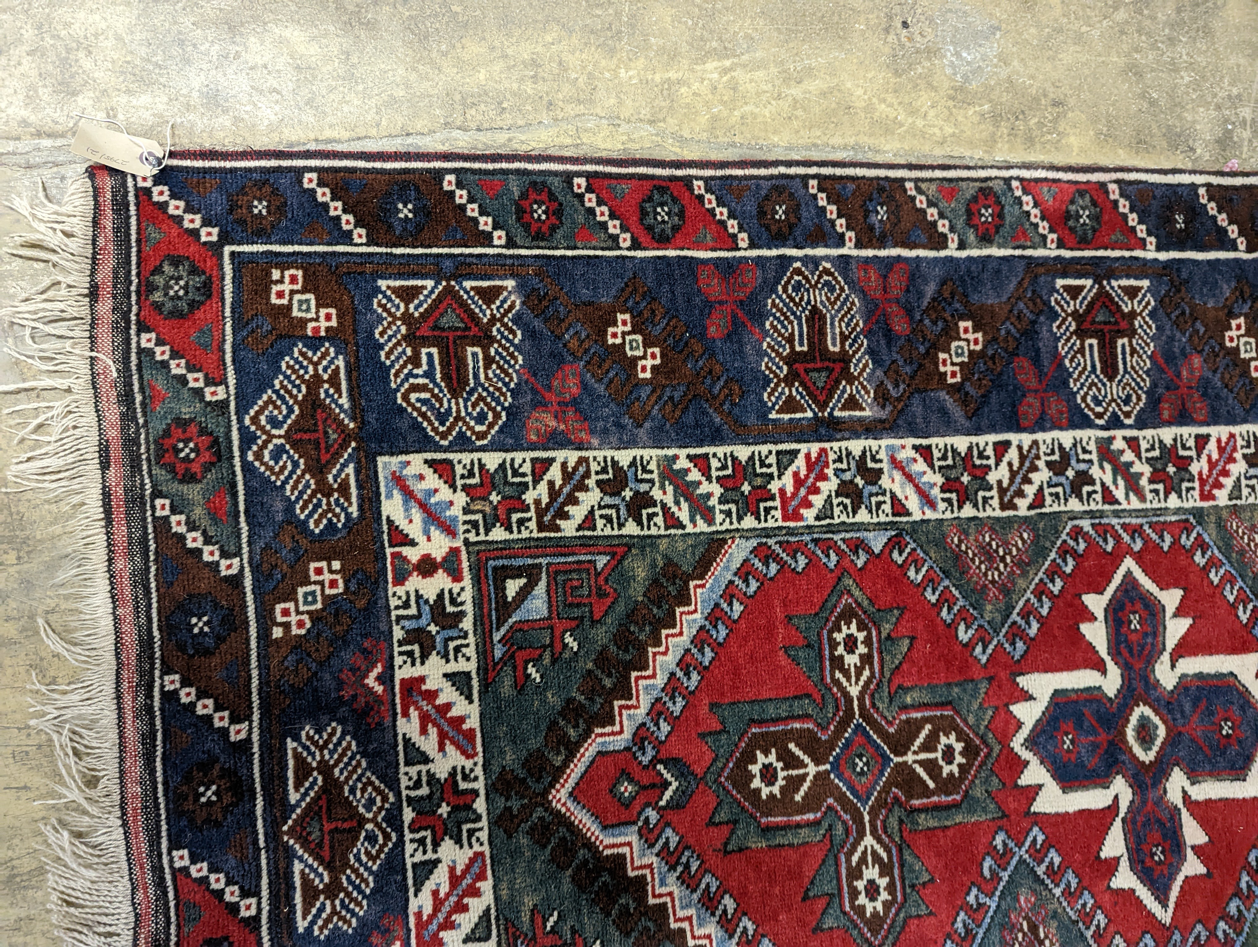Two Turkish rugs and a Persian rugs. Largest, 284x172cm.